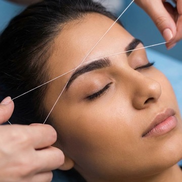 Eyebrow threading technique demonstration